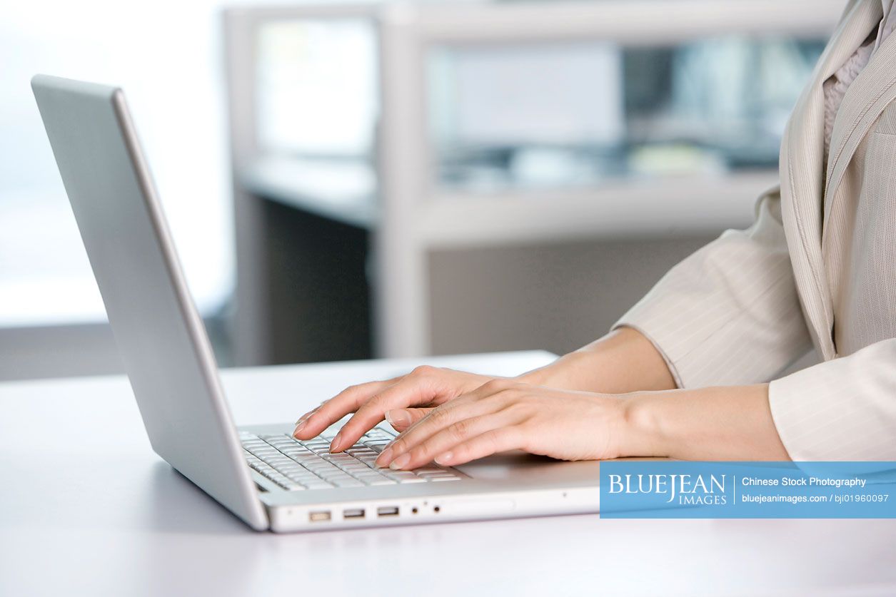 Office worker using her computer