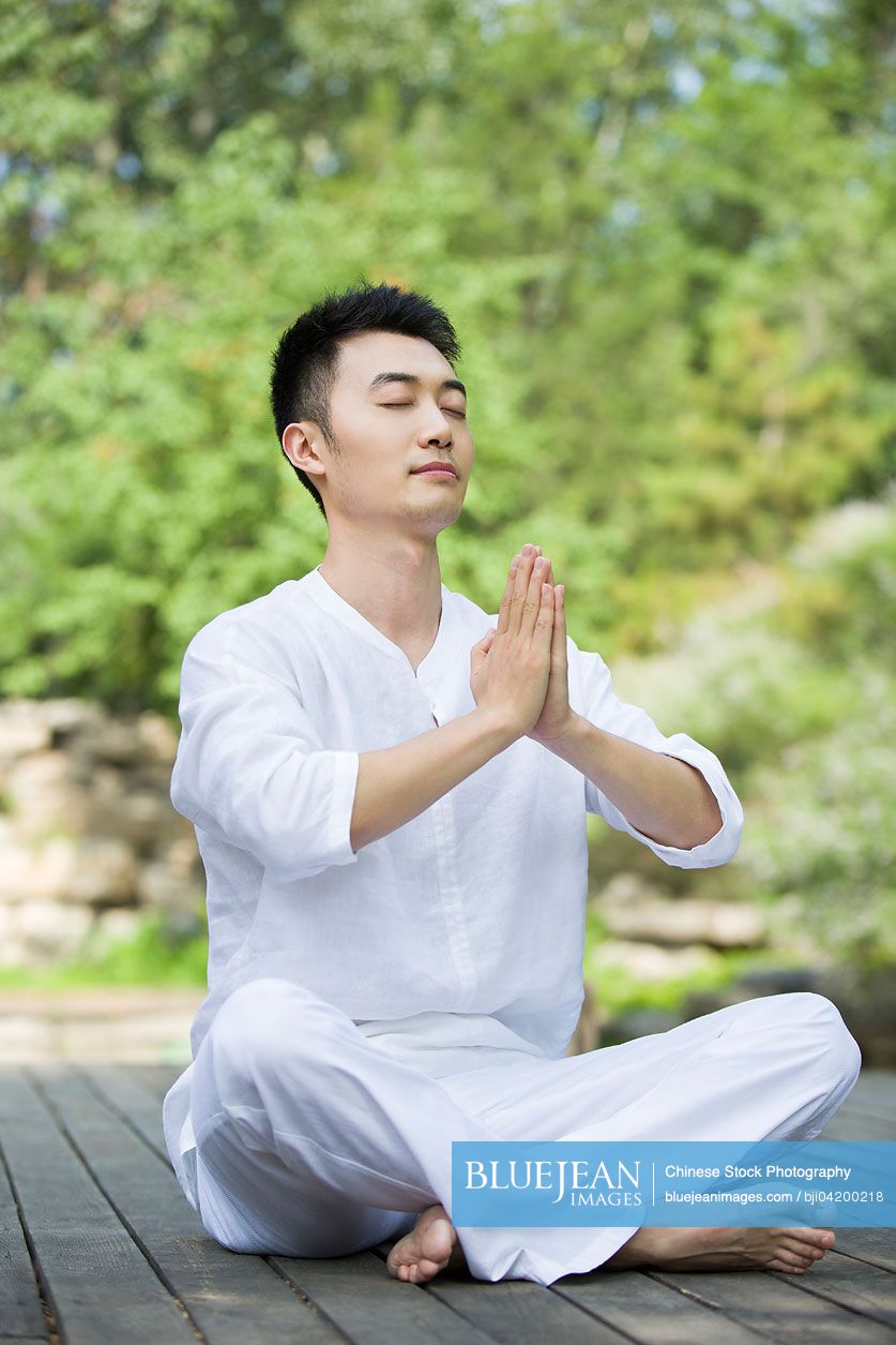 Young Chinese man practicing yoga