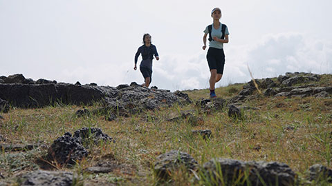 Happy Chinese couple trail running in nature,4K