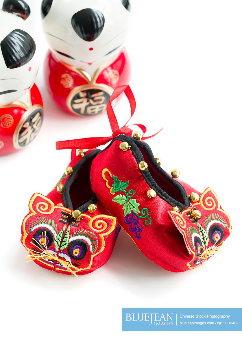 Tiger shoes and Chinese dolls