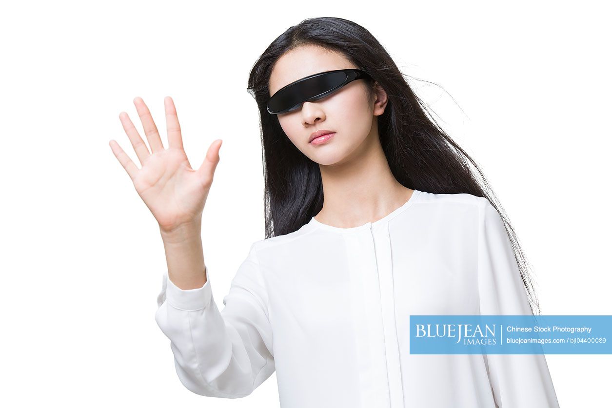 Young Chinese woman wearing a pair of smart glasses