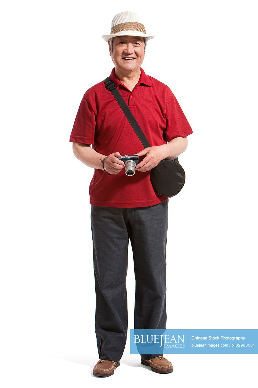 Portrait of senior Chinese man holding a camera