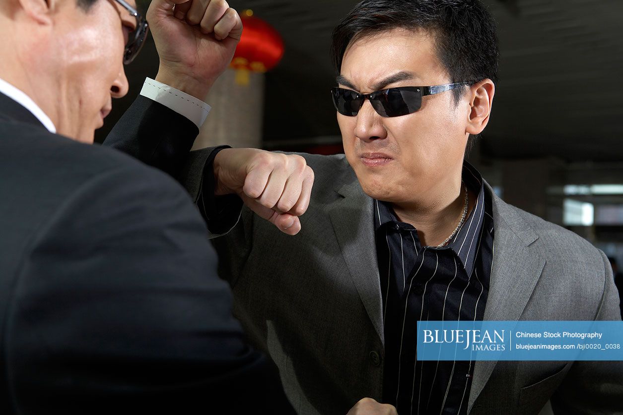 Chinese businessmen fighting