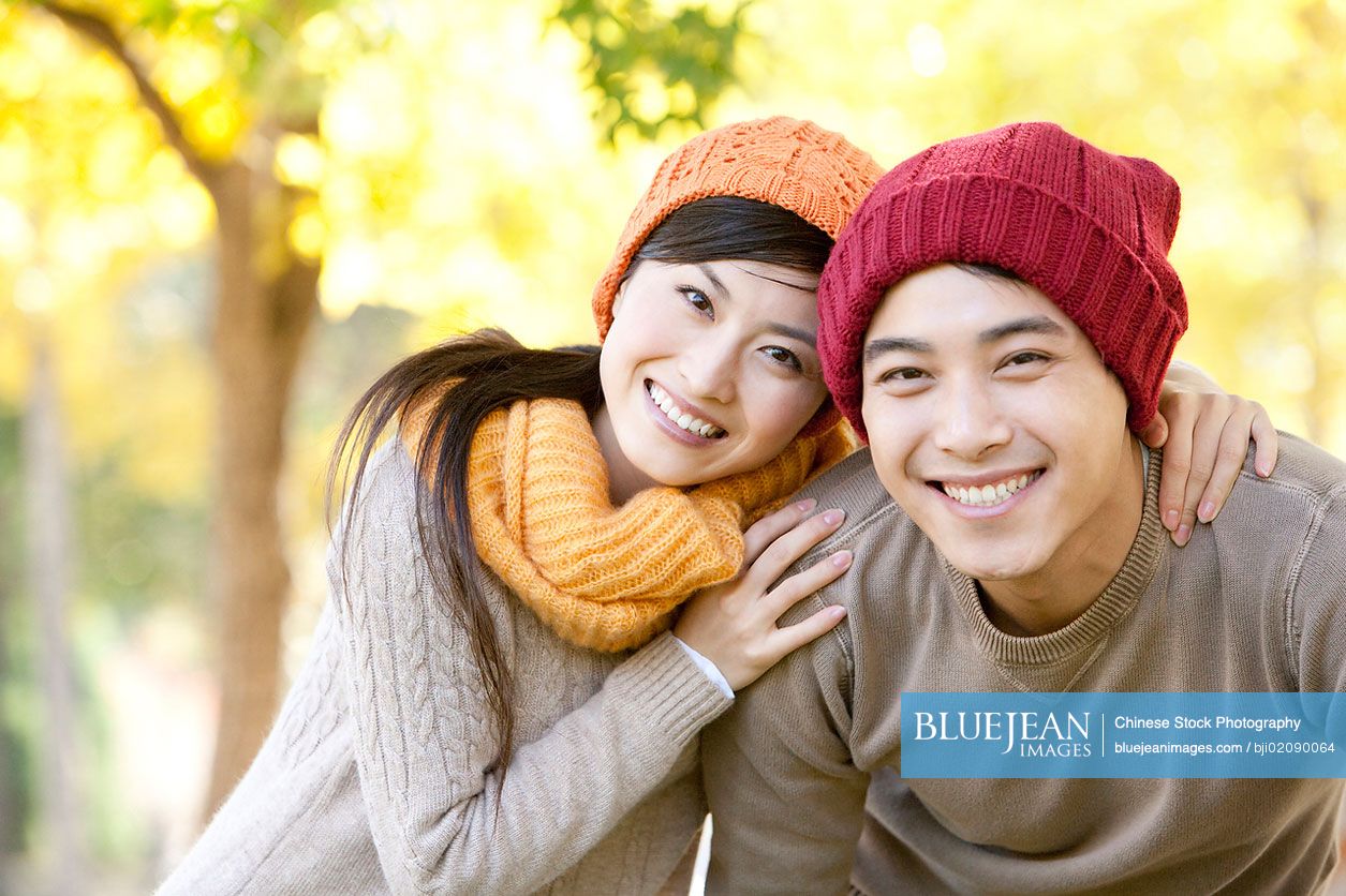 Young Chinese couple in a park in autumn-High-res stock photo for download
