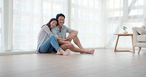 Happy young Chinese couple in living room,4K