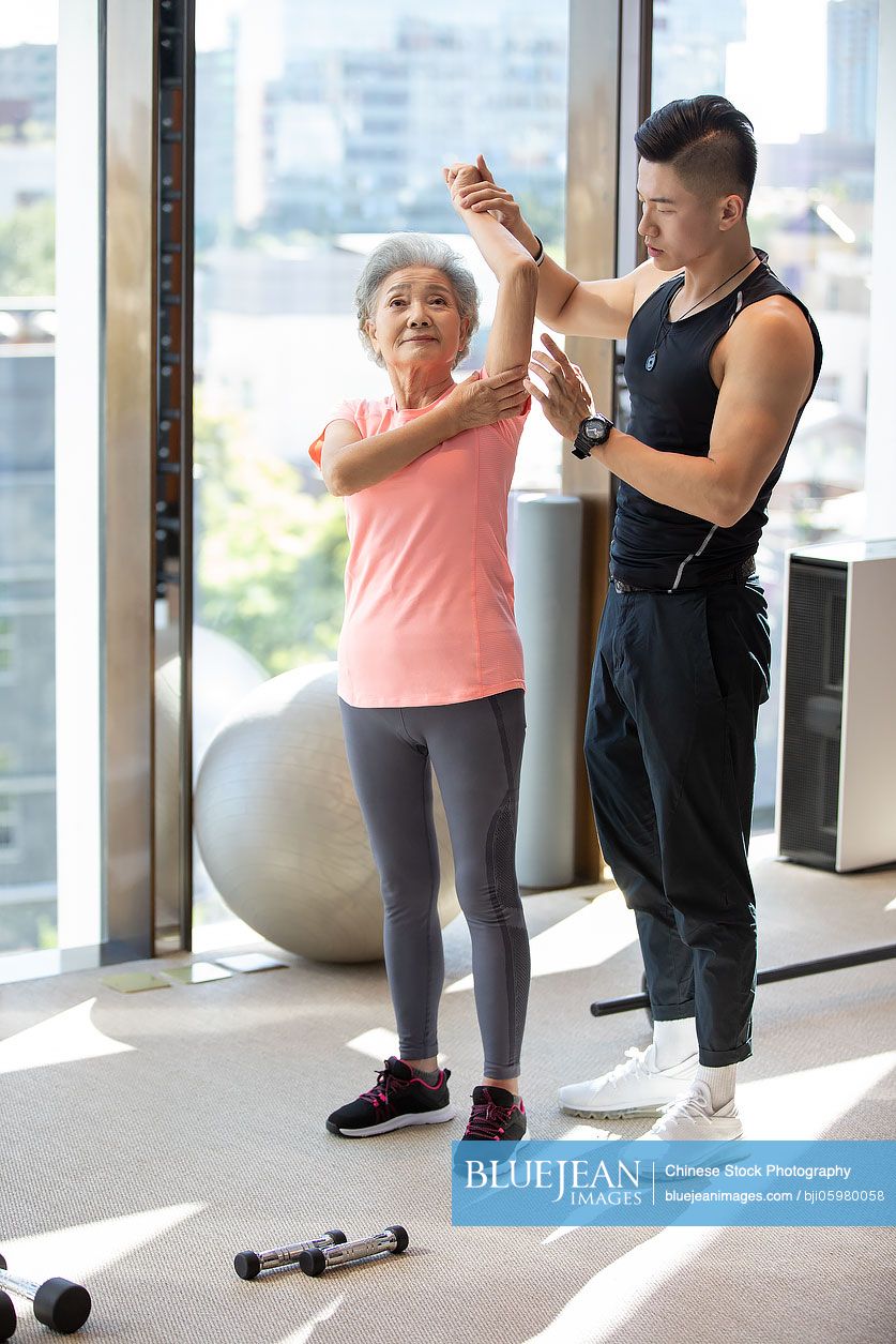 Senior Chinese Woman Exercising At Gym High res Stock Photo For Download senior-chinese-woman-exercising-at-gym-high-res-stock-photo-for-download