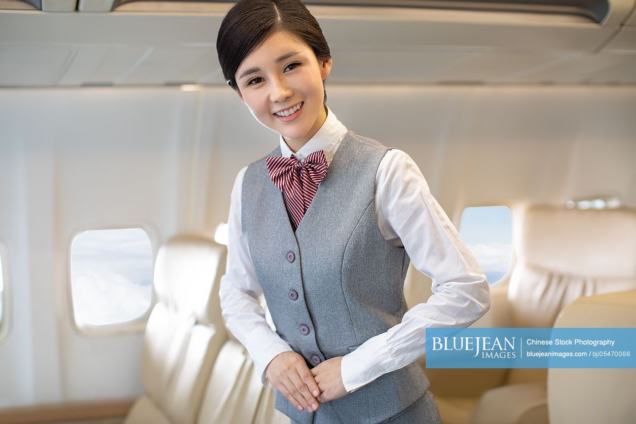 Smiling Chinese flight attendant