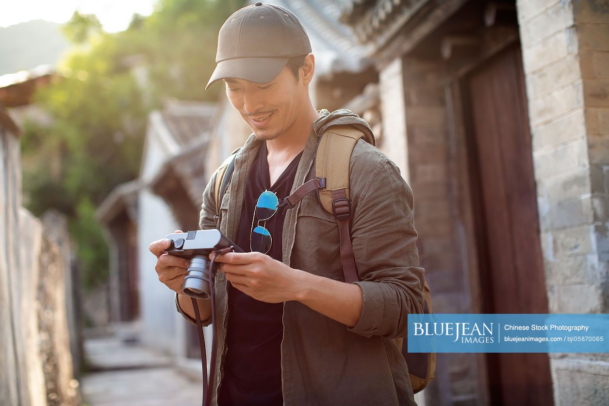 Chinese photographer taking photos in village