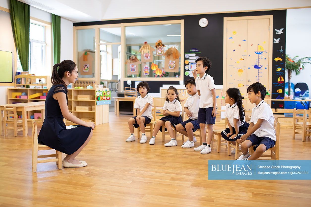 Chinese teacher and children in classroom
