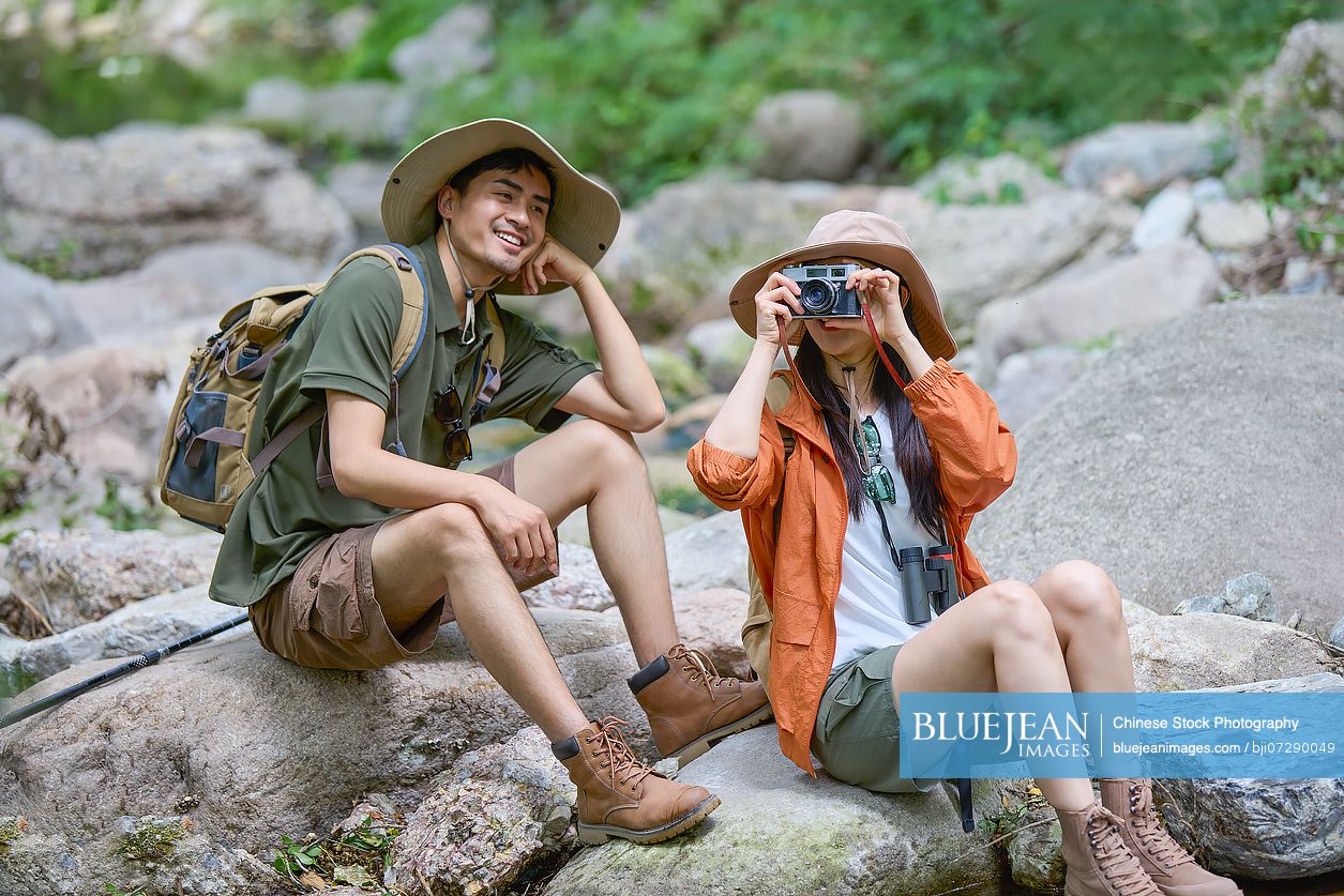 Happy couple hiking through the serene beauty of nature