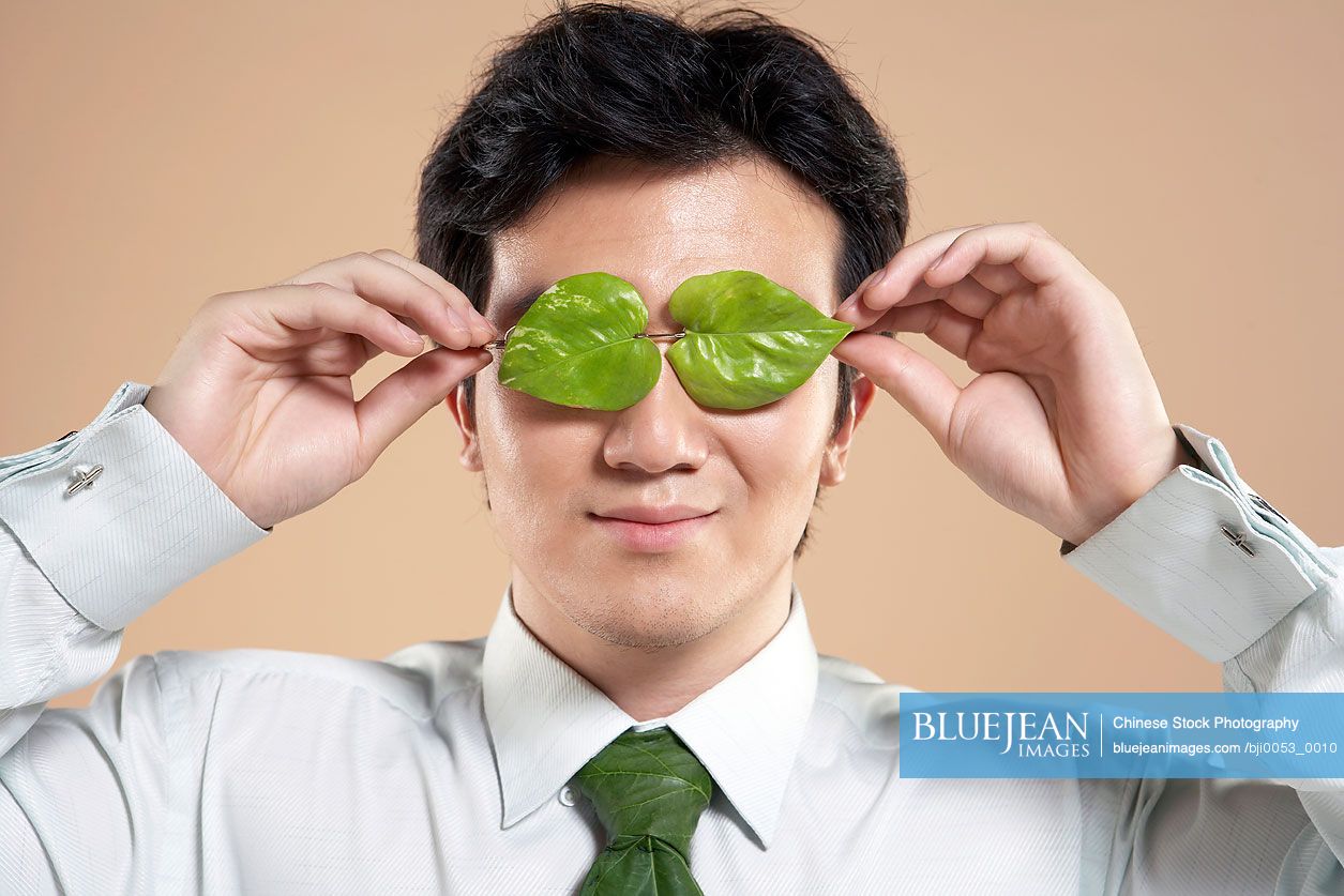 Chinese Man With Leaf Tie And Holding Leaves Up To His Eyes-High-res ...