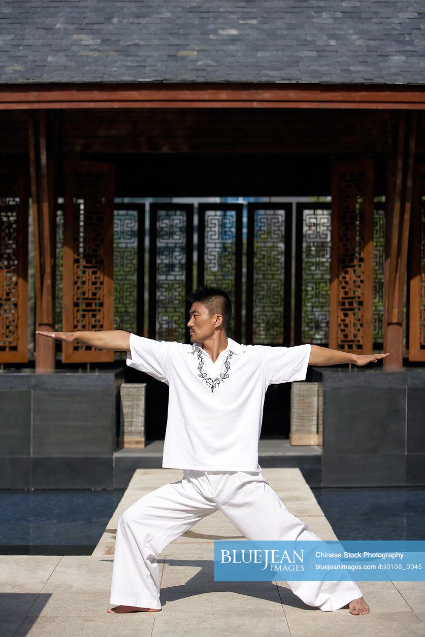 Chinese man meditating outdoors