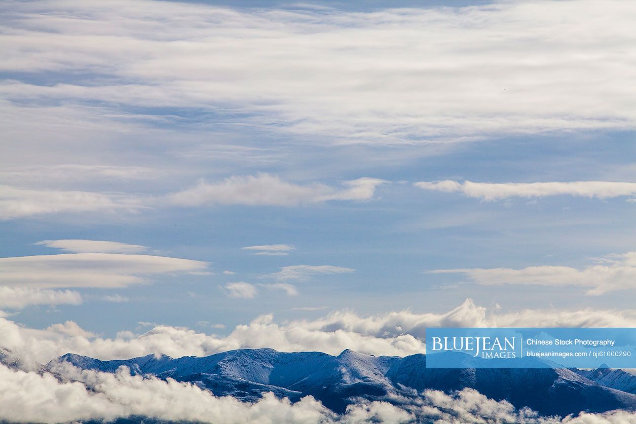 Snow mountains and cloudy sky in Tibet, China