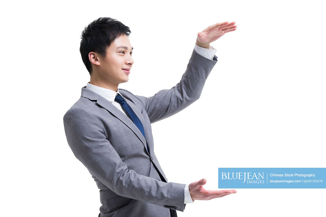 Young Chinese businessman gesturing