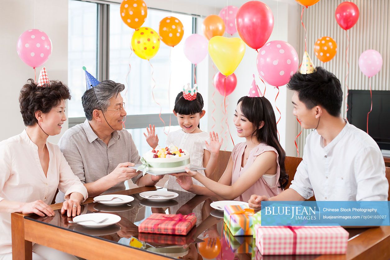 Happy Chinese family celebrating birthday