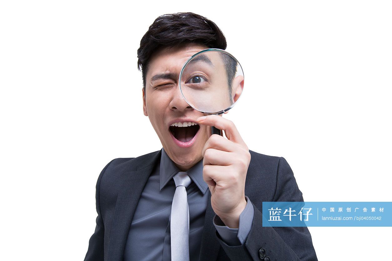 商务男士与放大镜