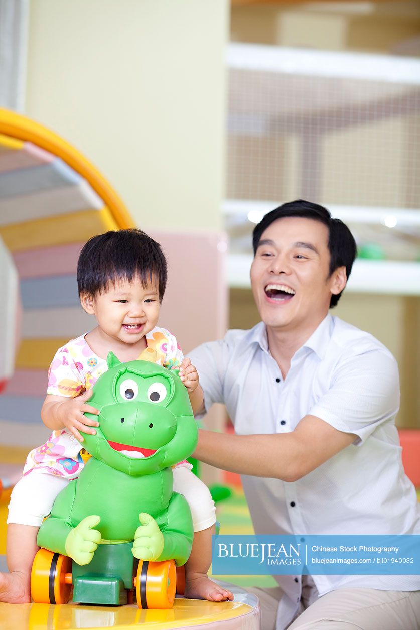 Chinese father playing with daughter