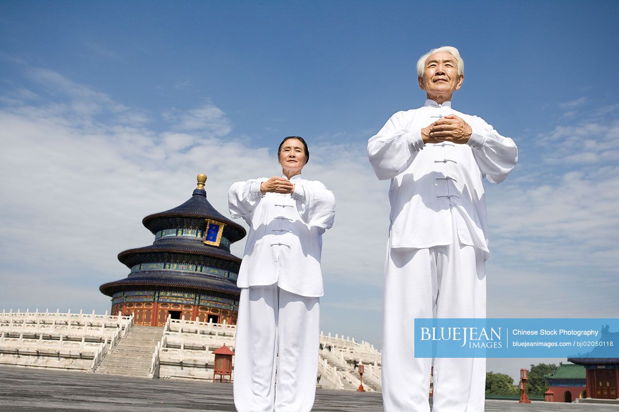 Senior Chinese couple practicing Tai Chi in Temple of Heaven