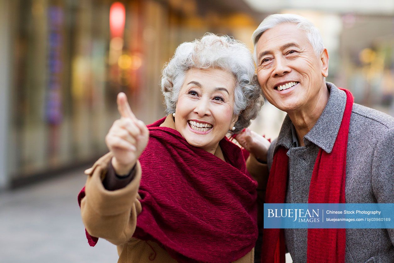 Senior Chinese couple shopping for Chinese New Year