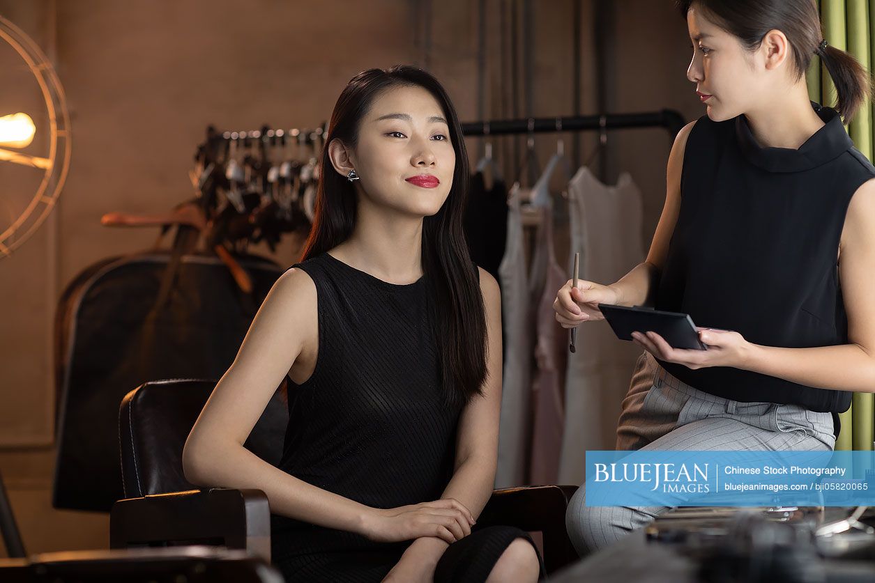 Chinese makeup artist applying makeup on model