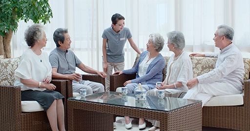 Happy senior Chinese friends talking in nursing home,4K
