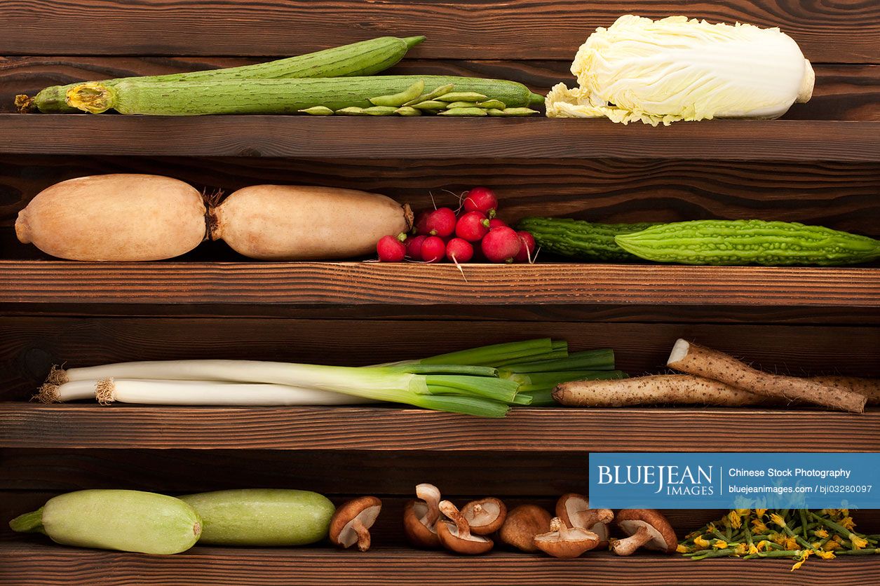 Various fresh vegetables on wooden shelf