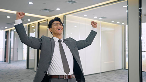 Chinese businessman thinking in empty office