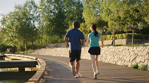Happy Chinese couple jogging