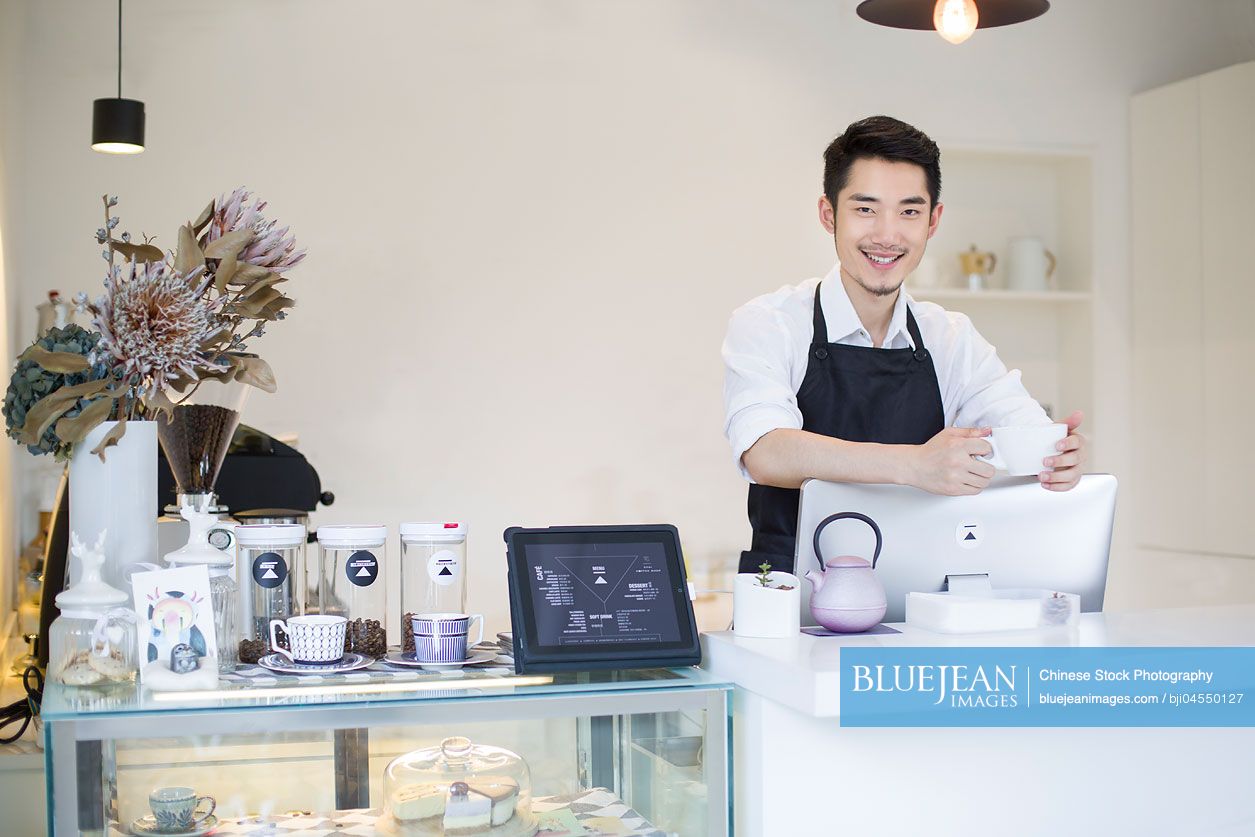 Portrait of Chinese coffee shop owner
