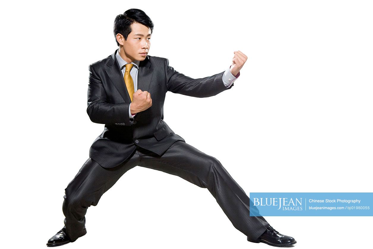 Chinese businessman waiting in fighting stance
