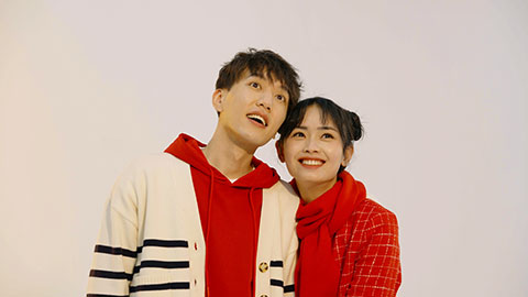 Happy young Chinese couple celebrating Chinese new year