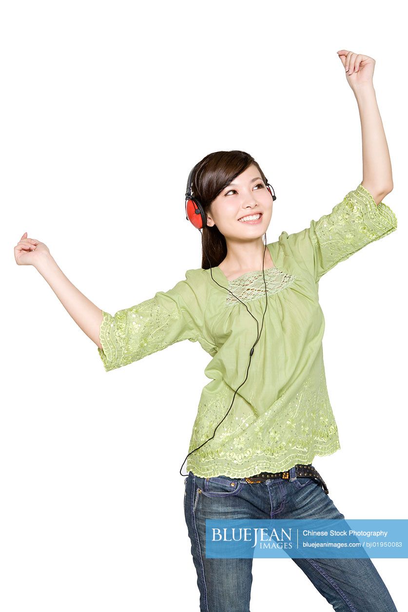 Portrait of young Chinese woman with headphones