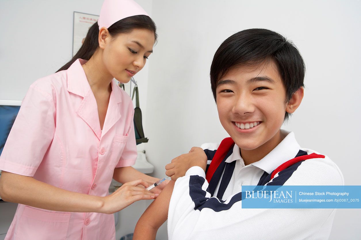 Chinese Nurse Injecting Boy