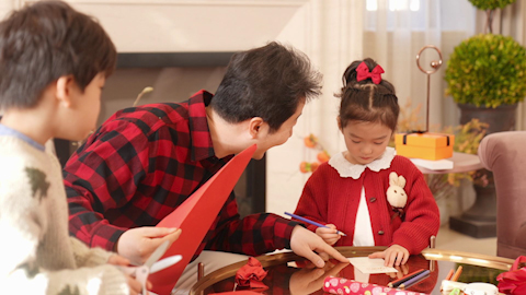 Family joyfully celebrating Chinese New Year together