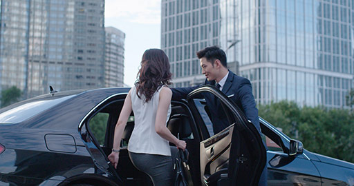 Confident Chinese businesswoman getting on car,4K
