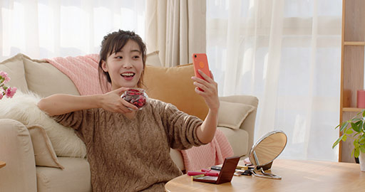 Young Chinese woman doing live webcast at home,4K