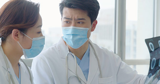 Young Chinese doctors discussing X-ray image,4K