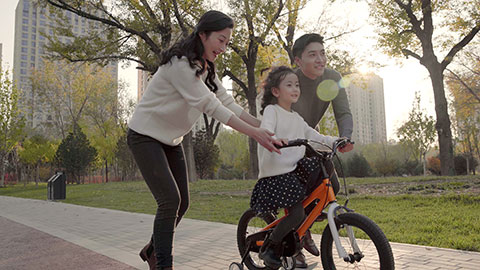 Chinese parents teaching child how to ride bike,4K
