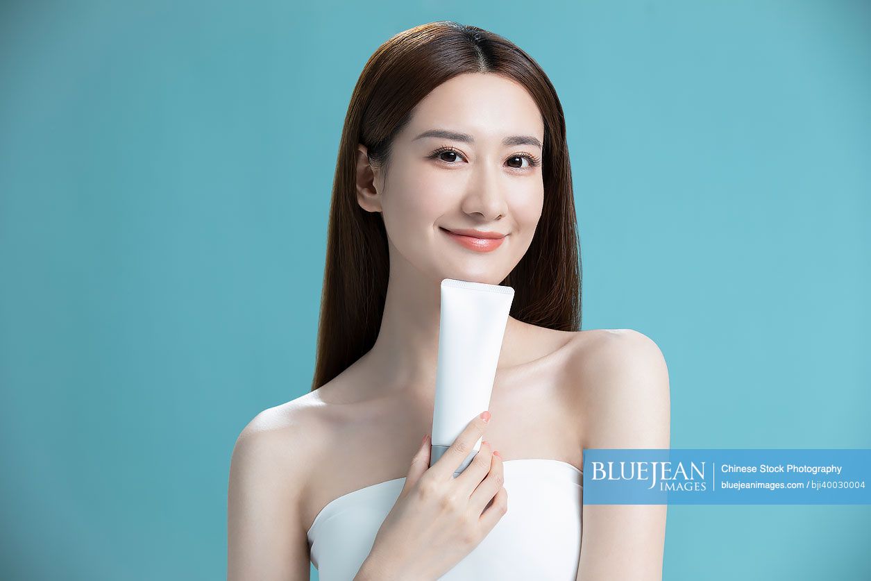 Beautiful young Chinese woman with face wash