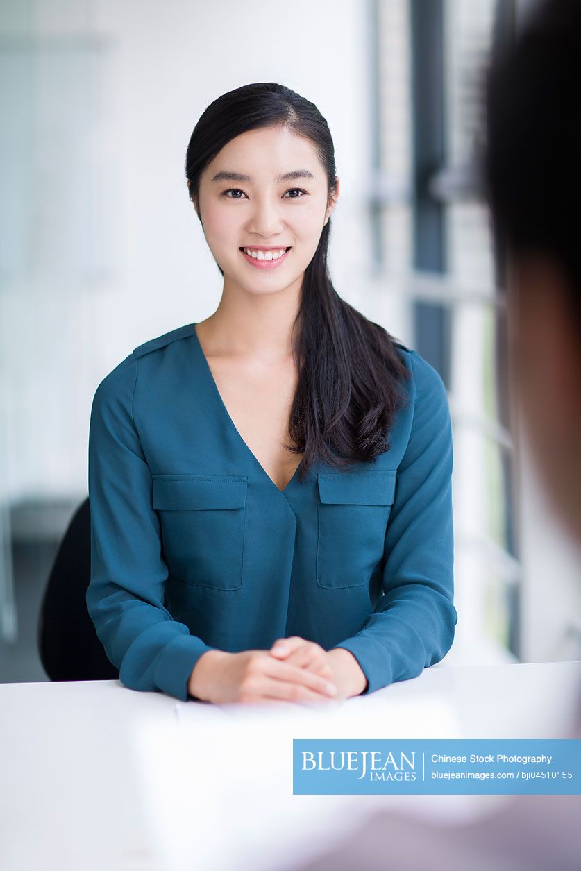 Young Chinese woman interviewing for a job