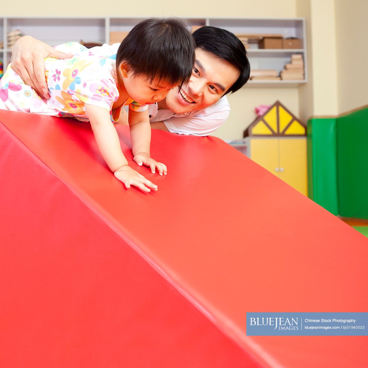 Chinese father playing with son