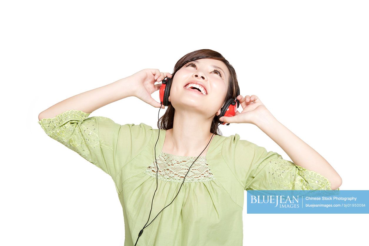 Portrait of young Chinese woman with headphones