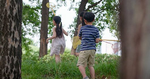 Three Chinese children playing in park,4K