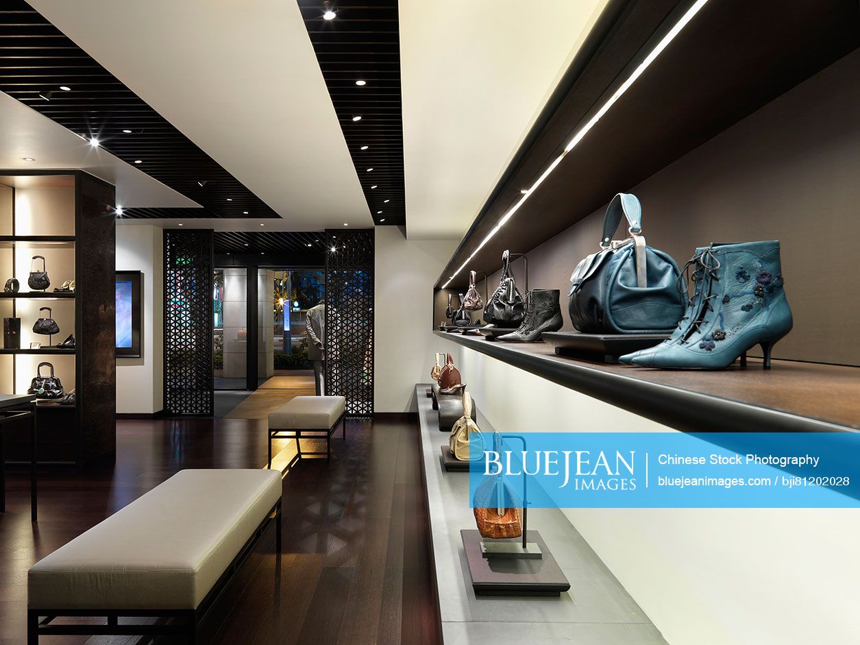 Purses and shoes on display in fashion store