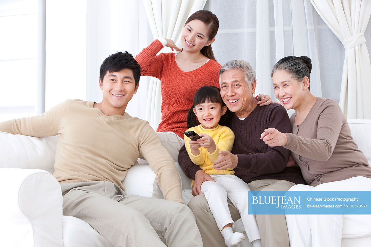 Chinese family watching TV together