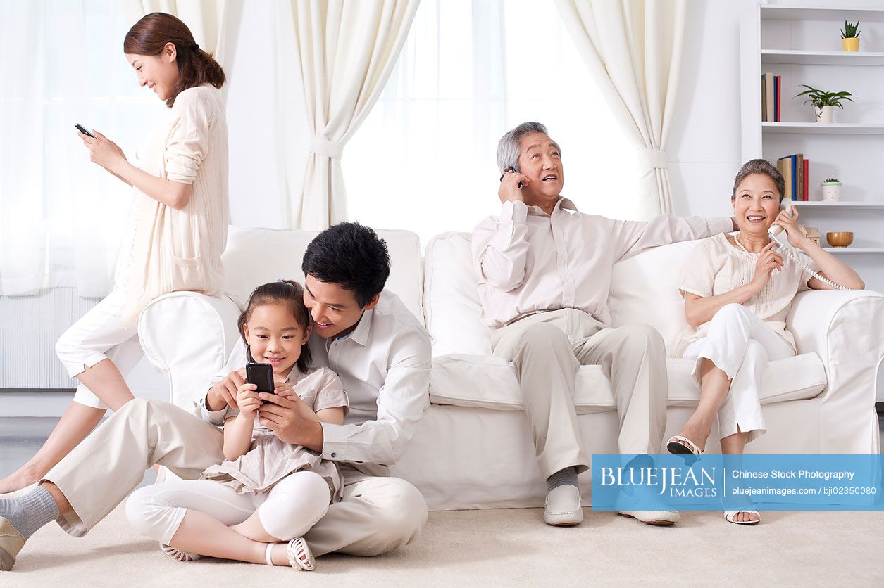 Chinese multi-generational family using phones