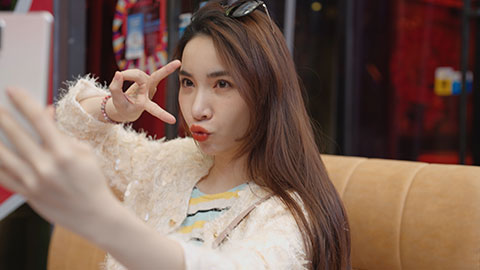 Cheerful young Chinese woman taking selfie with smartphone,4K