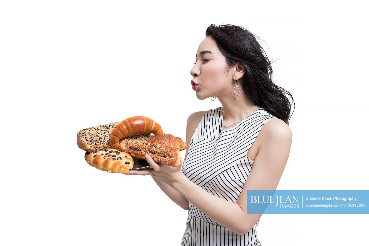 Fashionable young Chinese woman and bread