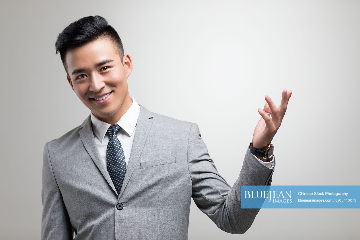 Portrait of cheerful young Chinese businessman