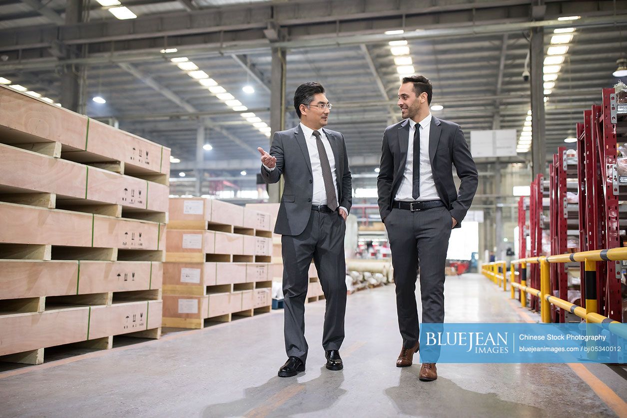 Business people talking in the factory